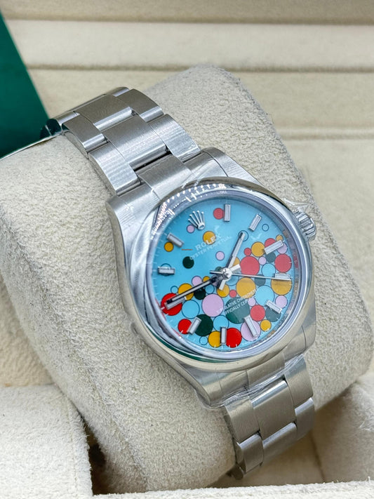 Rolex Oyster Perpetual 31 Watch - Domed Bezel - Turquoise Blue Celebration Motif Index Dial - Oyster Bracelet - 277200