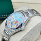 Rolex Oyster Perpetual 31 Watch - Domed Bezel - Turquoise Blue Celebration Motif Index Dial - Oyster Bracelet - 277200